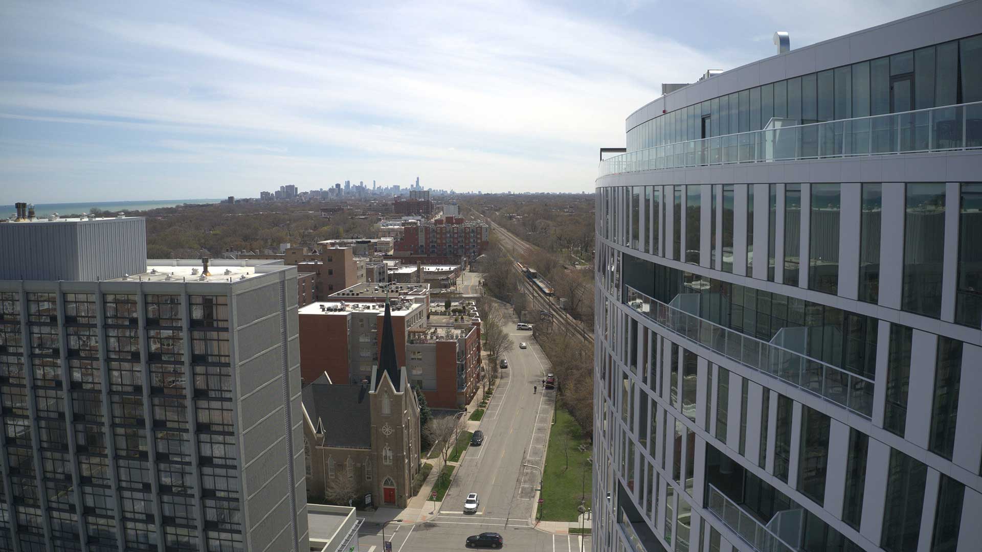 Elevated view from Eva in Evanston toward the Chicago skyline with Lake Michigan visible in the distance.