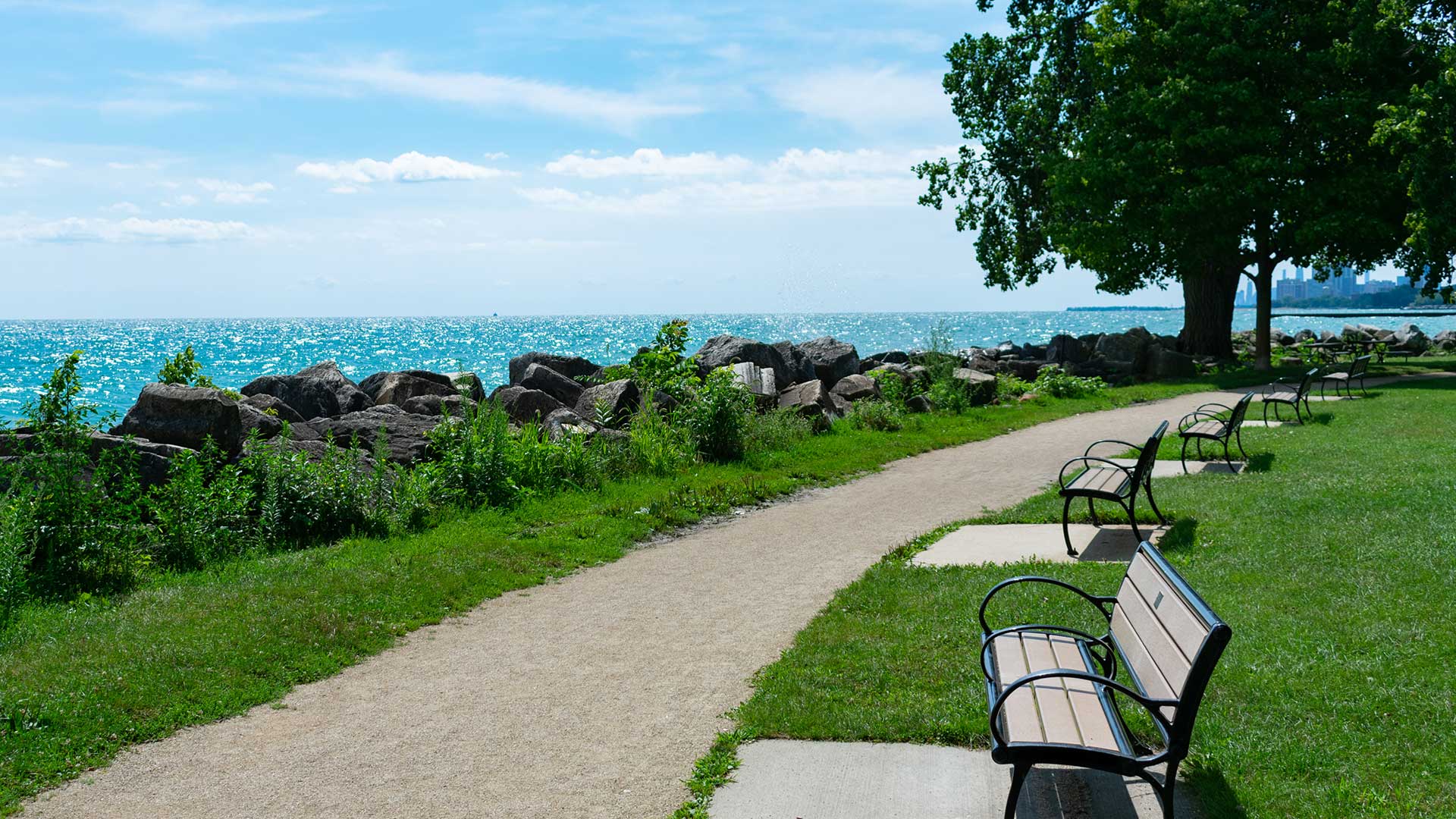 Benches and a walking path along the Lake Michigan shoreline in Evanston.